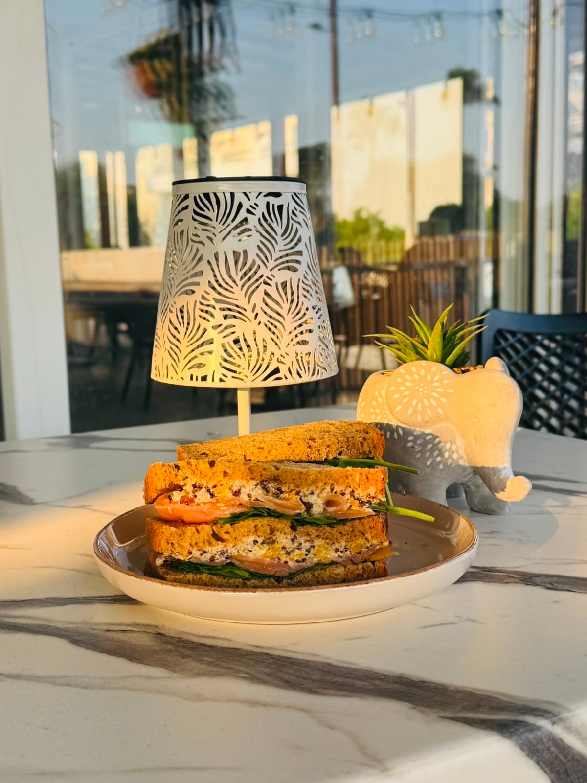 Salmon sandwich at golden hour on the terrace